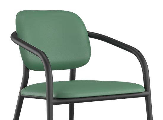 Chaise Appa Lounge à structure métallique noire et assise verte, avec dégagement hygiénique entre l’assise et le dossier, conçue pour les environnements de santé mentale